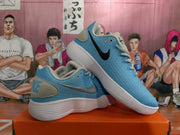 Angled view of paired blue and white Nike sneakers displaying the side swooshes, heel panels, laces, and white ribbed soles.