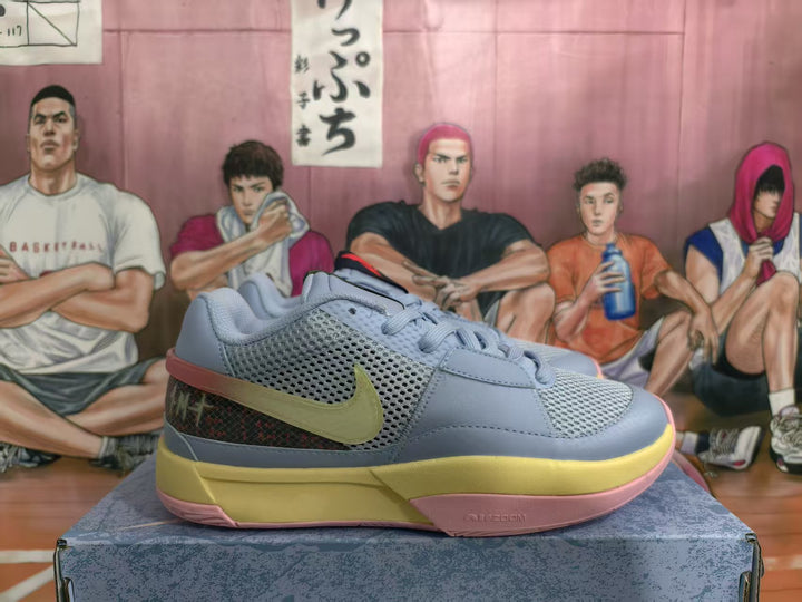 Side view of blue and gray Nike basketball sneakers with a visible Swoosh, mesh upper, yellow midsole, and pink outsole.