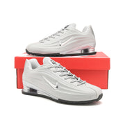 Silver Nike Shox Z R2 sneakers displayed on a red shoe box