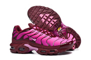 Nike Air Max Plus sneakers showing side details and patterned outsoles