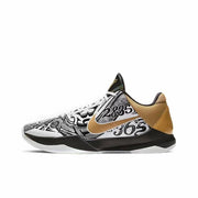 White, black and gold Kobe 5 basketball sneaker with a graphic printed upper.