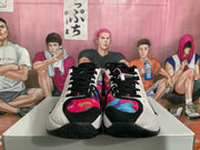 Front view of the pair showing black laces, multicolor toe panels, white sidewalls, and black rubber outsoles.