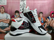 Angled view of the pair displaying the graphic side panels, white collars, red accents, black outsole, and basketball-style construction.