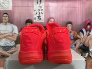 Rear view of the red basketball sneakers showing padded collars and tonal heel construction.