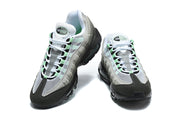 Front and angled views of Nike Air Max 95 TT sneakers with mesh uppers and white laces.