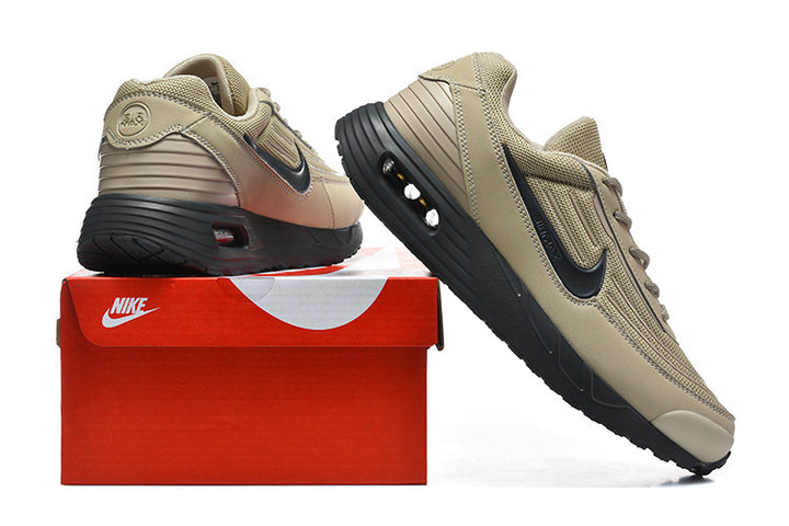 Tan and black Nike Air Max sneakers displayed with a red Nike shoe box.