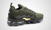 Rear three-quarter view of the olive green sneaker with heel pull tab.