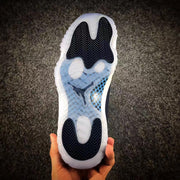 Underside view showing the translucent outsole, dark traction sections, and central Jumpman detail.