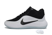 Side profile of a black and white Nike basketball sneaker with layered wave detailing.