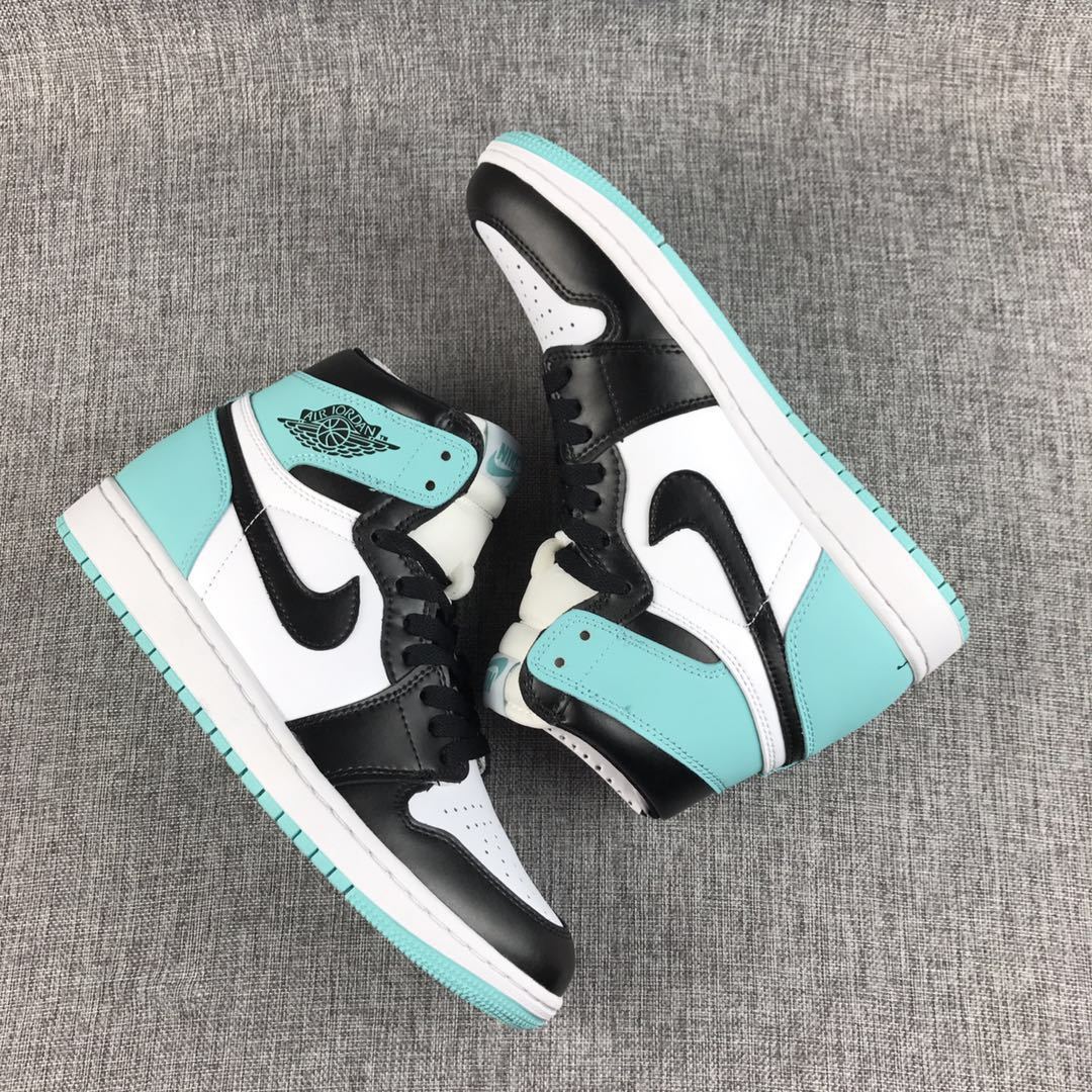 Pair of mint green, black, and white Air Jordan 1 high-top sneakers displayed from above.