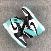 Pair of mint green, black, and white Air Jordan 1 high-top sneakers displayed from above.