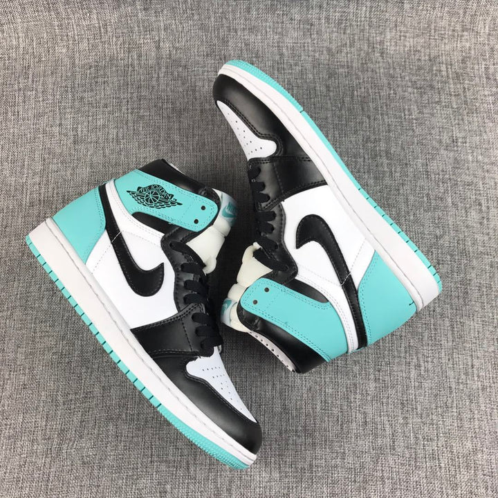 Pair of mint green, black, and white Air Jordan 1 high-top sneakers displayed from above.