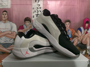 Angled view of the black-and-white basketball shoes with red accents