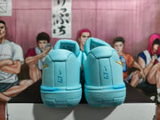 Rear view of the blue Nike basketball shoes showing heel details and textured panels.
