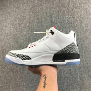 Opposite side profile of the white Jordan Air Jordan 3 sneaker with black midsole detailing and a translucent outsole.