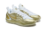 Pair of white and metallic gold Nike sneakers shown from the front and side.