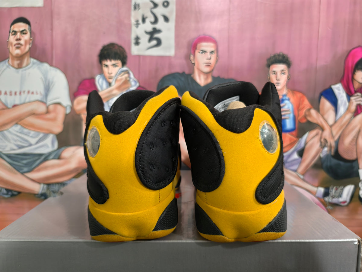 Rear view of black and yellow high-top basketball sneakers