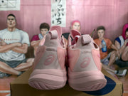Rear view of pink ASICS basketball sneakers showing padded collars, heel panels and textured outsoles.