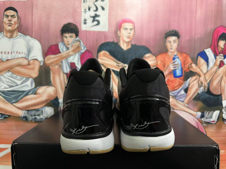 Rear view of Nike Kobe 6 basketball shoes showing black heel sections and light-colored midsoles.