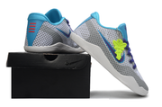 Gray and blue Kobe 11 shoes posed on a black shoe box