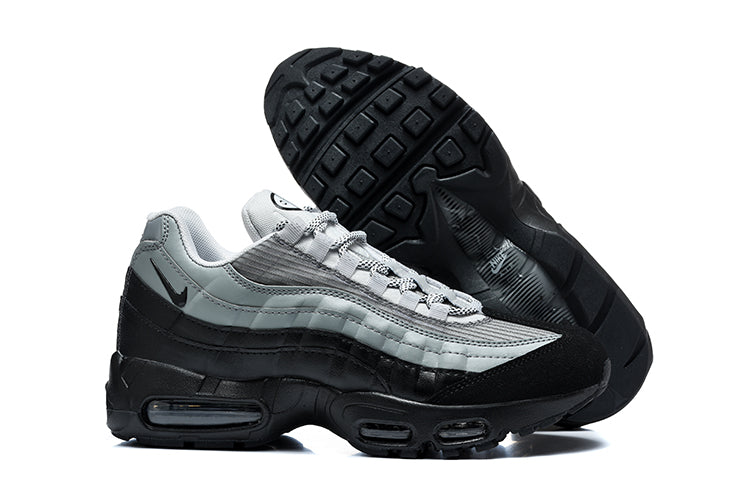 Grey and black Nike Air Max 95 sneaker shown from the side with its outsole visible