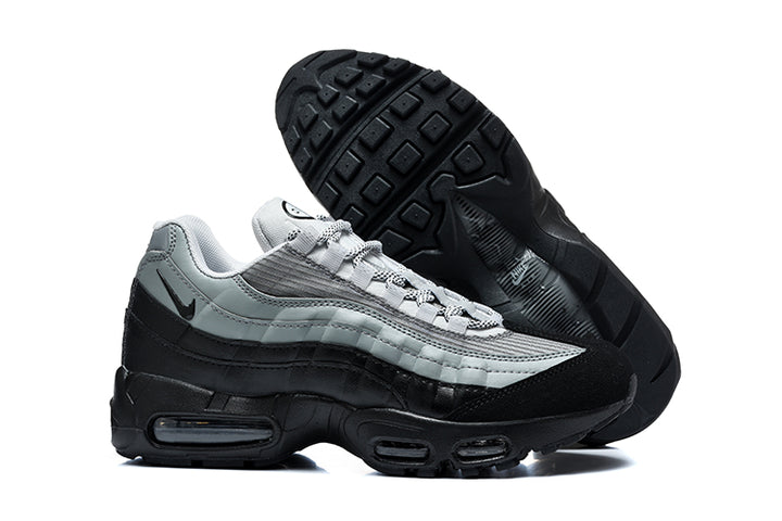 Grey and black Nike Air Max 95 sneaker shown from the side with its outsole visible
