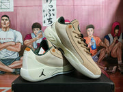 Angled view of the beige Jordan sneaker pair showing the side panels, lace-up construction, heel details, and outsole.