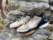 Angled front view of the pair showing the patterned toe boxes, striped laces, and black heel panels.