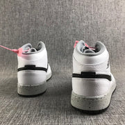 Rear view of the pair showing white heel panels, black horizontal accents, and speckled midsoles.