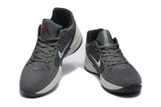 Pair of gray and black Jordan sneakers shown from a front three-quarter view.
