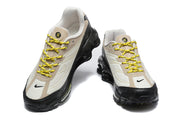 Front view of the beige, cream and black Nike Shox Ride 2 sneakers.