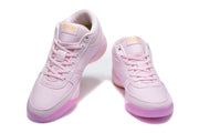 Pair of pink Nike mid-top sneakers shown from a front three-quarter angle.
