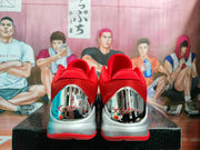Rear view highlighting the red padded collars and reflective heel panels with signature-style graphics.