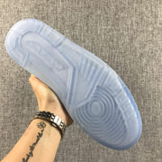 View of the translucent icy blue outsole with its molded traction pattern.