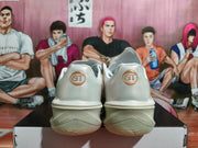 Rear view showing circular GT heel logos and sculpted outsoles