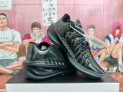 Black Nike basketball shoes arranged in a side view, showing the Swoosh and lace-up design