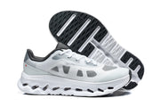 White and grey Cloudtilt Remix sneaker shown beside its patterned outsole.