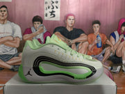 Side profile of the green and gray basketball sneaker with black curved detailing and visible cushioning text on the midsole.