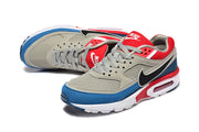 Angled view of the grey, blue, red, and black Nike Air Max BW sneakers.