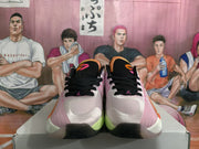 Front view of the pair showing black laces, pale pink uppers, white toe panels, and black rubber toe sections.