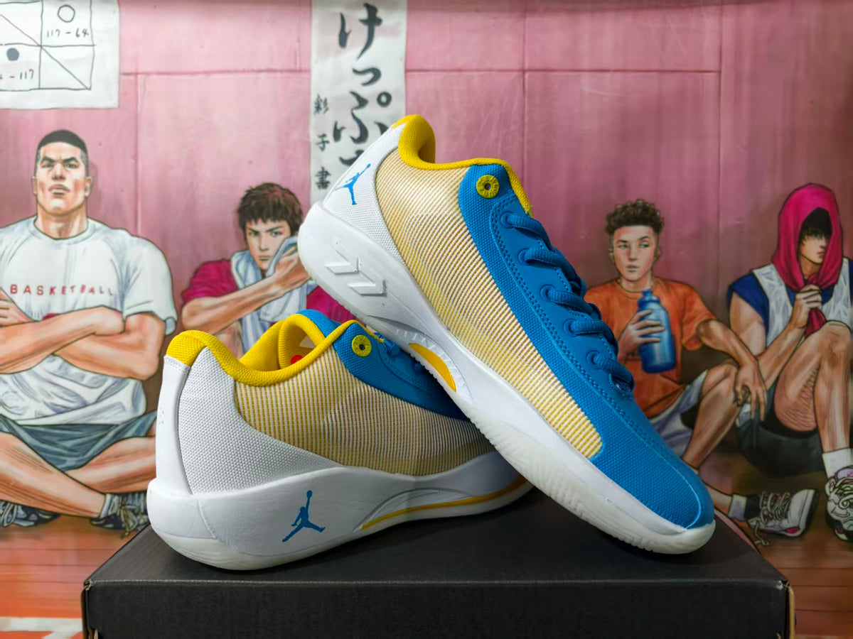 Pair of blue and yellow Jordan basketball shoes showing striped side panels and white soles