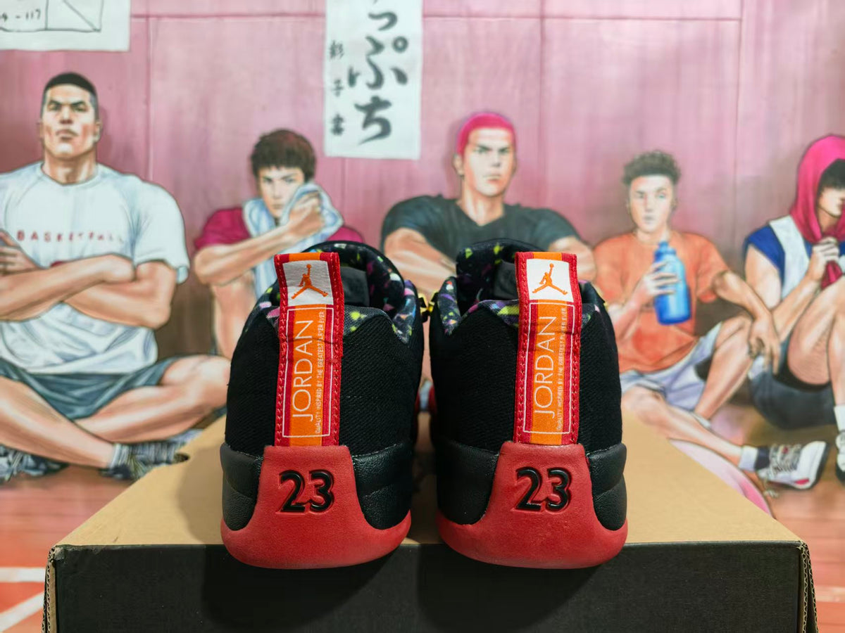Rear view of black and red Jordan basketball sneakers with number 23 heel details and red branded pull tabs.