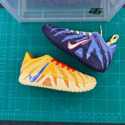 Lavender and navy shoe paired with a golden yellow and cream shoe, shown from above