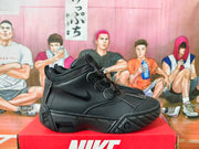 Black Nike high-top basketball sneaker shown from the side on a red shoe box.