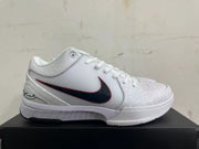 Side view of a white Kobe basketball shoe with a dark red-edged Swoosh and patterned overlays