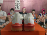 Rear view of white Nike running shoes showing coral heel and sole accents.