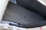 Close-up of the black inner collar and stitched interior of the sneaker.