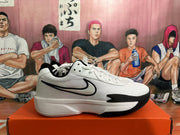 Side view showing the black Swoosh on a white Nike basketball shoe