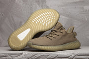 Pair of brown-tan 350 V2 style sneakers showing the woven upper and translucent ribbed soles.