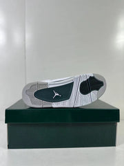 Outsole view showing the white and green traction pattern and Jumpman emblem.
